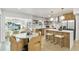 Open concept kitchen with white countertops, stainless steel appliances, and a dining area at 8704 Thornwood Ln, Tampa, FL 33615