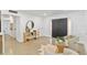 Open living room with modern decor, a mirror, and decorative seating at 8704 Thornwood Ln, Tampa, FL 33615