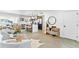 Open-concept living space with sleek furnishings and a modern kitchen with island at 8704 Thornwood Ln, Tampa, FL 33615