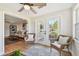 Bright sunroom with wicker chairs and view to the manicured backyard at 8899 53Rd N Way, Pinellas Park, FL 33782