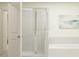 Modern bathroom with a glass-enclosed shower, soaking tub, and clean, minimalist design at 9308 Cannon Beach Dr, Parrish, FL 34219