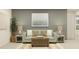 Cozy living room featuring a comfortable sofa, accent tables, and a serene atmosphere at 9308 Cannon Beach Dr, Parrish, FL 34219