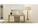 Well-lit home office with a simple desk, beach artwork, and elegant floor lamp at 9308 Cannon Beach Dr, Parrish, FL 34219