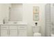 Bright bathroom featuring a modern vanity, toilet, and a shower with a striped curtain at 9324 Bonita Mar Dr, Parrish, FL 34219