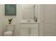 Clean bathroom with a toilet, sink and vanity, and minimalist decor at 9324 Bonita Mar Dr, Parrish, FL 34219