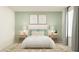 Stylish bedroom with a cozy bed, decorative pillows, and matching bedside tables and lamps at 9324 Bonita Mar Dr, Parrish, FL 34219