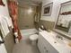 Bathroom featuring decorative tiles and a shower-tub combination at 1 Boca Ciega Point Blvd # 213, St Petersburg, FL 33708