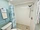 Clean and renovated bathroom features a shower with a decorative shower curtain at 1 Boca Ciega Point Blvd # 213, St Petersburg, FL 33708