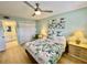 Bedroom features a walk-in closet and ensuite bathroom, with light green walls at 1 Boca Ciega Point Blvd # 213, St Petersburg, FL 33708
