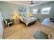 Relaxing bedroom featuring light green walls and an inviting floral bedspread at 1 Boca Ciega Point Blvd # 213, St Petersburg, FL 33708