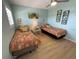 Bedroom features two twin beds with tropical bedding and matching pillows at 1 Boca Ciega Point Blvd # 213, St Petersburg, FL 33708