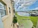 Picturesque view from the lanai, overlooking lush greenery and waterfront docks for boat storage at 1 Boca Ciega Point Blvd # 213, St Petersburg, FL 33708