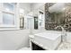 Bathroom featuring a modern square vessel sink, ornate mosaic mirror and dark wood vanity at 101 30Th N Ave, St Petersburg, FL 33704