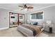 Bright bedroom with large mirror, neutral decor, natural light, and a ceiling fan at 101 30Th N Ave, St Petersburg, FL 33704
