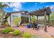 Charming courtyard featuring brick pavers, fire pit and a pergola providing shade at 101 30Th N Ave, St Petersburg, FL 33704