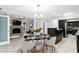 Dining area with stylish light fixture, adjacent to modern kitchen and cozy living room at 101 30Th N Ave, St Petersburg, FL 33704