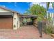 Charming home with a brick driveway, mature trees, and a covered carport at 101 30Th N Ave, St Petersburg, FL 33704
