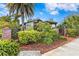 Exterior view of house showcasing brick walkway, landscaping, and inviting entrance at 101 30Th N Ave, St Petersburg, FL 33704
