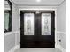 Elegant front entryway with decorative glass double doors and neutral decor at 101 30Th N Ave, St Petersburg, FL 33704