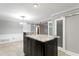 Kitchen island featuring granite top, modern cabinetry with access to open floor plan at 101 30Th N Ave, St Petersburg, FL 33704
