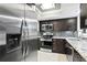 Modern kitchen with stainless steel appliances, dark cabinets, and granite countertops at 101 30Th N Ave, St Petersburg, FL 33704