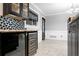 Kitchen area showcasing wine fridge, modern backsplash, and access to dining area and entry at 101 30Th N Ave, St Petersburg, FL 33704