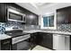 Close up of the kitchen featuring stainless steel oven, microwave, dishwasher and mosaic backsplash at 101 30Th N Ave, St Petersburg, FL 33704