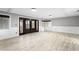 Large open living room featuring wainscoting, hardwood floors, and natural light at 101 30Th N Ave, St Petersburg, FL 33704