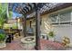 Outdoor brick patio with a fire pit, pergola and seating area perfect for entertaining at 101 30Th N Ave, St Petersburg, FL 33704
