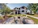 Charming backyard with a cozy fire pit surrounded by comfortable seating, perfect for outdoor entertaining at 10787 Oak Ne St, St Petersburg, FL 33716