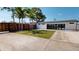 Large backyard with a privacy fence and a well-manicured lawn at 10787 Oak Ne St, St Petersburg, FL 33716