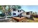 Outdoor deck with ample space, decorative accents and a view of the surrounding trees at 10787 Oak Ne St, St Petersburg, FL 33716