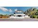Modern two-story building featuring expansive windows, a well-maintained landscape, and convenient parking at 10787 Oak Ne St, St Petersburg, FL 33716