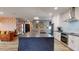 Modern kitchen featuring a large island, white cabinets, and stainless steel appliances at 10787 Oak Ne St, St Petersburg, FL 33716