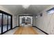 Large living room with a chandelier and a view to other rooms at 10787 Oak Ne St, St Petersburg, FL 33716
