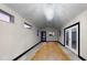 Spacious living room with a chandelier and large windows for natural light at 10787 Oak Ne St, St Petersburg, FL 33716