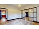 Bright living room with glass walls, a plush area rug, and stylish interior finishes at 10787 Oak Ne St, St Petersburg, FL 33716