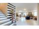 Grand lobby featuring tile floors, decorative knight statue, and striped accent wall leading to the staircase at 10787 Oak Ne St, St Petersburg, FL 33716