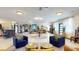 Bright and expansive lobby with stylish seating arrangements, artistic decor, and a sophisticated design at 10787 Oak Ne St, St Petersburg, FL 33716