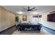Contemporary meeting room features a wood accent wall, modern lighting, large table and TV for presentations at 10787 Oak Ne St, St Petersburg, FL 33716