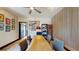 Office space features a wood accent wall, modern lighting, and unique artwork for an inspiring work environment at 10787 Oak Ne St, St Petersburg, FL 33716
