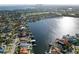 Scenic aerial showcases waterfront homes along a tranquil canal, with glimpses of city skyline in the distance at 1100 Cordova Ne Blvd, St Petersburg, FL 33704