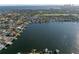 Scenic aerial view of a waterfront residential area with luxurious houses and a wide, calm waterway at 1100 Cordova Ne Blvd, St Petersburg, FL 33704
