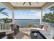 A covered balcony with an outdoor seating area features beautiful water views at 1100 Cordova Ne Blvd, St Petersburg, FL 33704