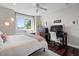 Bedroom features a large window with waterfront views, a work desk and a bright interior at 1100 Cordova Ne Blvd, St Petersburg, FL 33704
