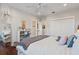 Bedroom featuring neutral colors and a white bed, with dark hardwood floors, and a view to another bedroom at 1100 Cordova Ne Blvd, St Petersburg, FL 33704