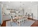 Dining area features open layout to gourmet kitchen, hardwood floors, and large windows at 1100 Cordova Ne Blvd, St Petersburg, FL 33704