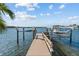 A dock with a boat lift has canal views and offers the perfect waterfront lifestyle at 1100 Cordova Ne Blvd, St Petersburg, FL 33704