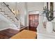 Bright foyer with hardwood floors, a staircase, and an impressive double door at 1100 Cordova Ne Blvd, St Petersburg, FL 33704