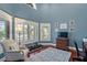 Comfortable home gym with blue walls, natural light, and a view of the outdoors at 1100 Cordova Ne Blvd, St Petersburg, FL 33704